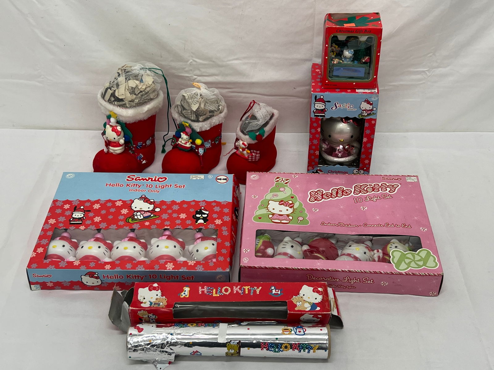 Vtg Sanrio Hello Kitty Christmas & Lights - Ornaments , Sanrio Smiles & Gift Box Musical, (2)Light: Vtg Sanrio Hello Kitty Christmas & Lights - Ornaments , Sanrio Smiles & Gift Box Musical, (2)Light Sets, Aluminum Foil Roll ''Pleasantime'', (3)Felt Santa Boots (All From Retired Sanrio Employee)