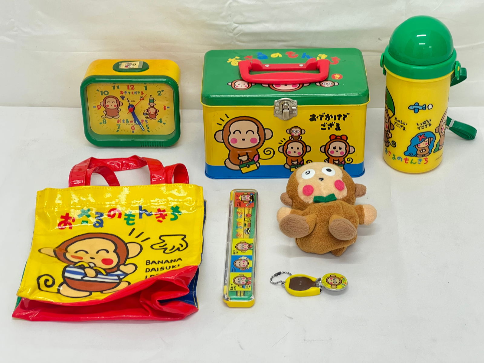 Vintage Sanrio Monkichi Items - Clock Handled Plastic Bag, Metal Handled Container, Chopsticks, (1 of 5)