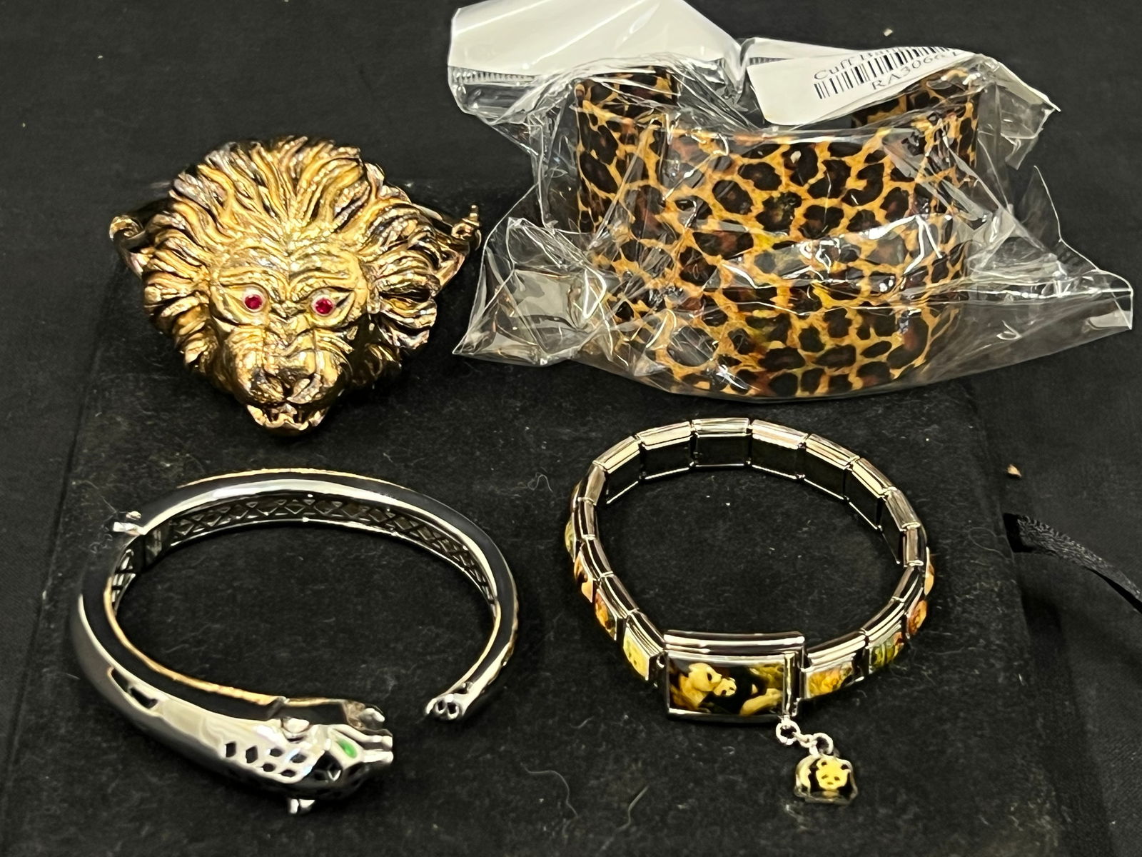 Sterling Italy Lion Bracelet with Ruby Eyes,Cuff + More - (4)Bracelets Total - (1)Panther Bracelet,: Sterling Italy Lion Bracelet with Ruby Eyes,Cuff + More - (4)Bracelets Total - (1)Panther Bracelet, (1)Sterling Lion, (1)Charming Touches Animal Bracelet, (1)Cuff in Bag