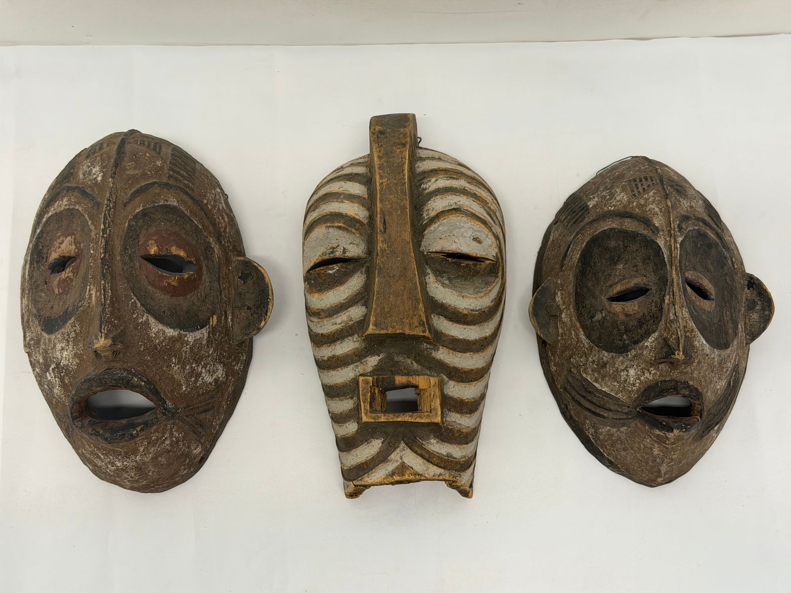 (3)African Carved Antique / Vintage Masks: Hand Carved & Painted , 12" x 6.5" to 10.5" x 6.75"