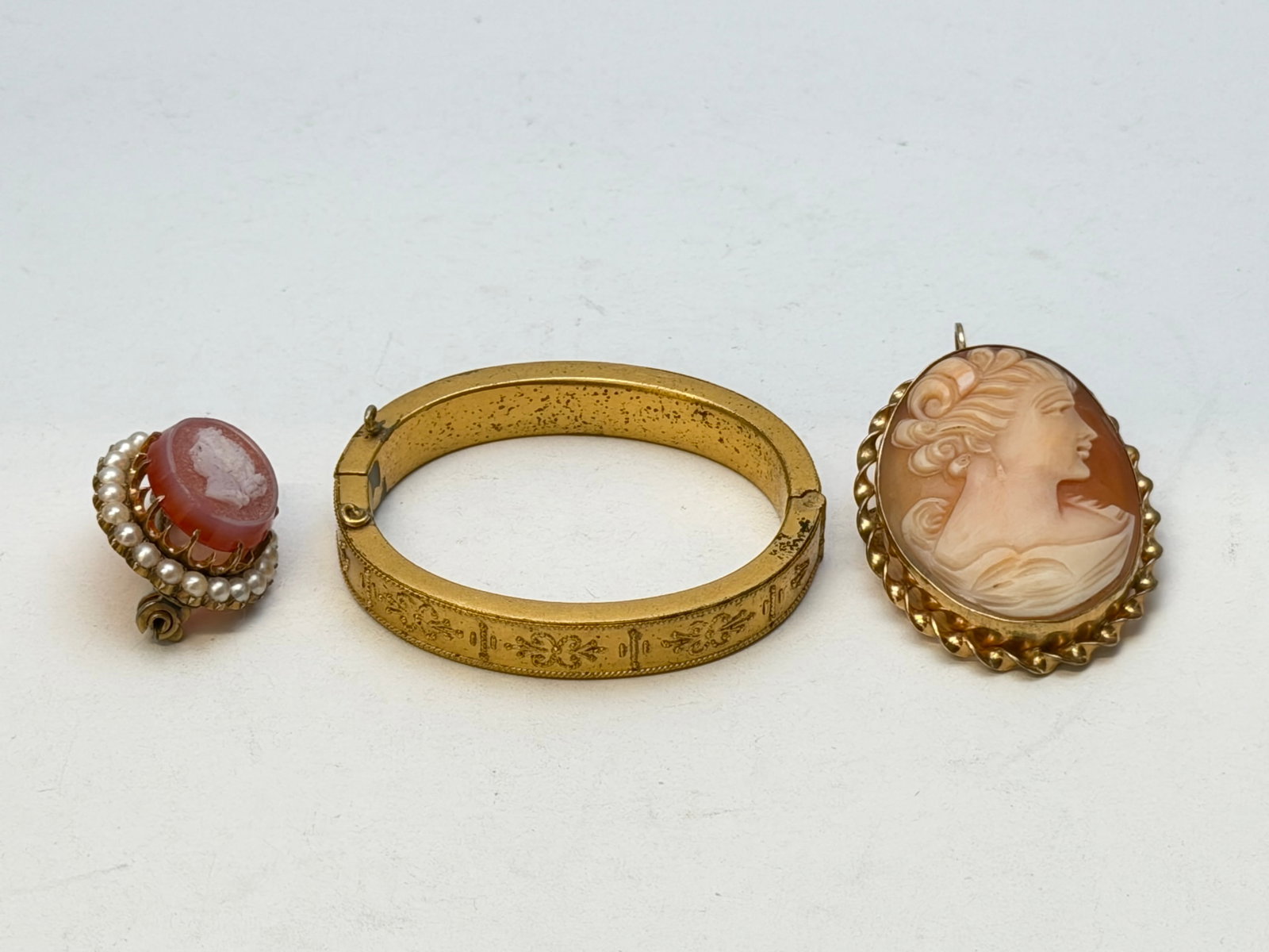 (2)Cameos & Antique Baby Bracelet: (1)12K Gold Filled Cameo, (1)Cameo with Surrounding Pearls, (1)Metal Baby Bracelet (Hinge Needs Work, See Photos)