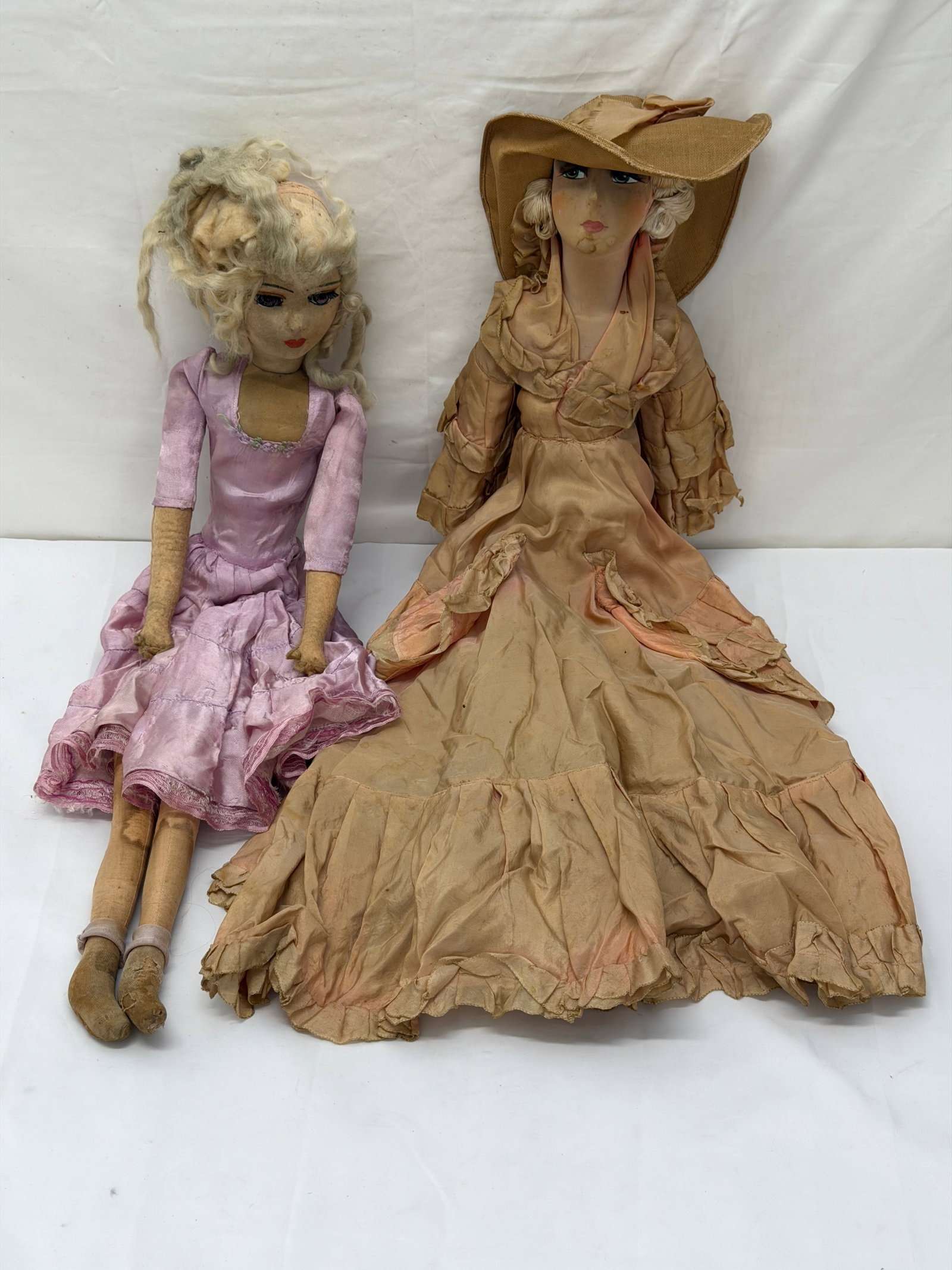 (2)1920s French Boudoir Doll - Hand Painted Face with Silk Clothes: Cloth Face - Hand Painted (1) with Floppy Hat & Silk Clothing, Porcelain Hands & Feet, (1) Cloth with Pink Dress 30"L