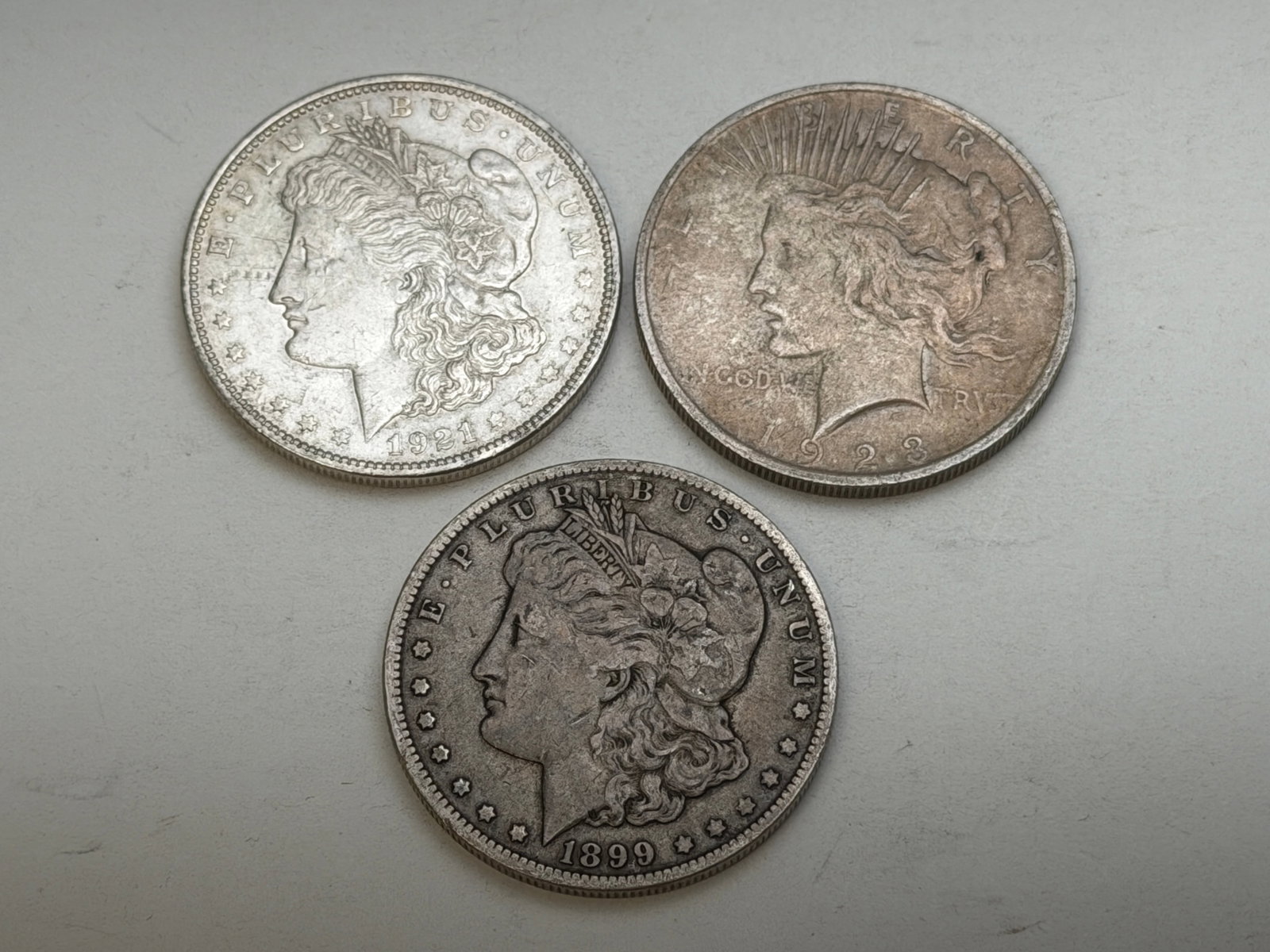 (3)Antique Silver Dollars - Peace & Morgan - Wgt 79.8g: 1899 Morgan, 1921 Morgan, 1923 Peace - Wgt 79.8g