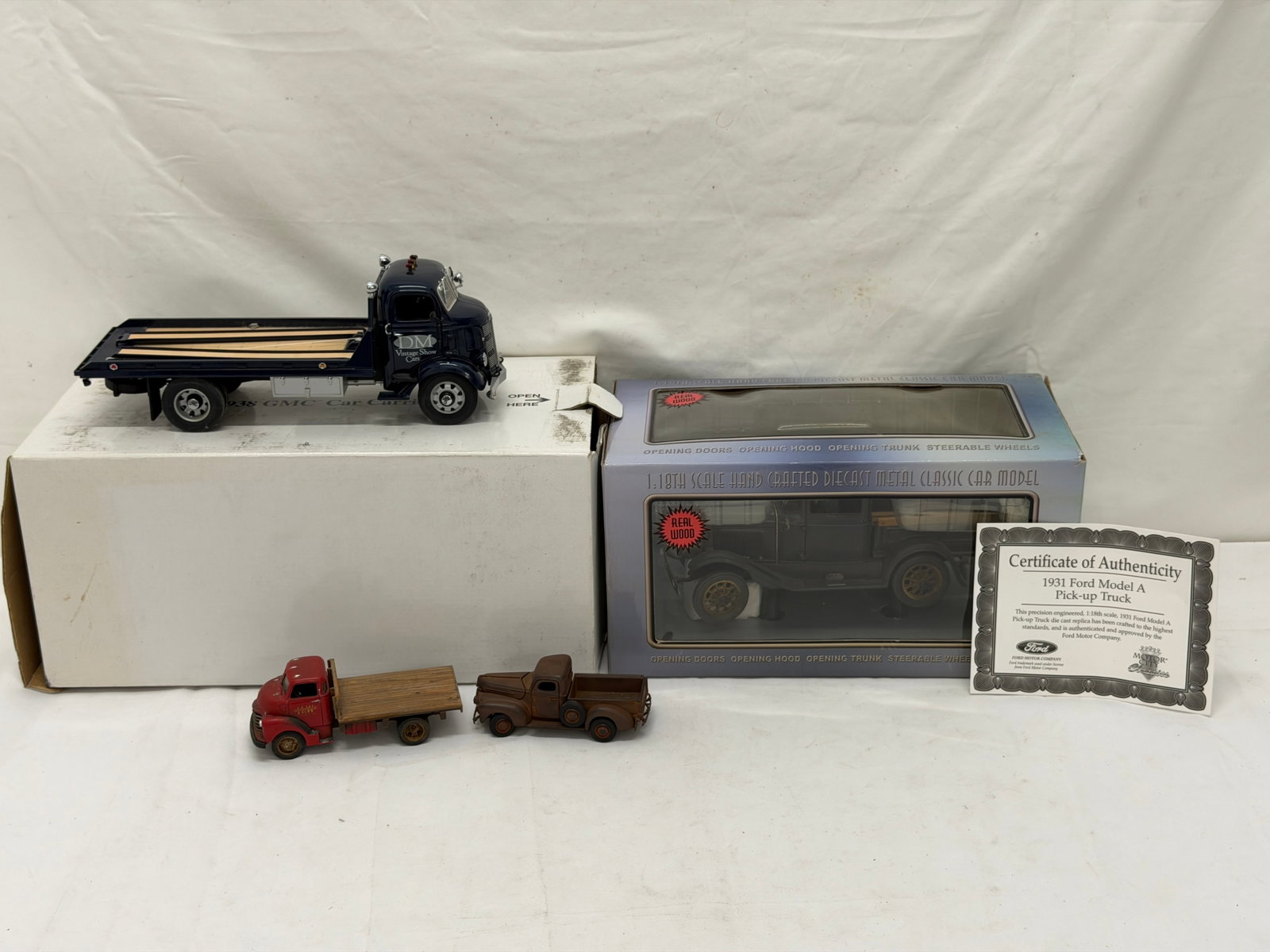 DieCast Cars - 1938 GMC Carrier + 1931 Model A Rustic Weathered Truck: 1938 GMC Cab over Car Carrier by Danbury Mint 1:24 Scale, Ertl Small Truck, Motor City Classic 1931 Model A Pick-Up with Weathered Rust & Real Wood, Small Truck