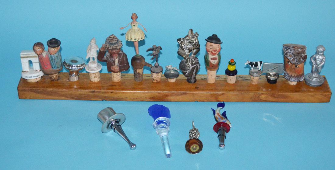 Wonderful Collection of Bottle Stoppers: Lot of stoppers from antique to contemporary. Includes a Versace Medusa, carved wooden Italian, metal, glass, Thai etc. Fun Whimsical collection