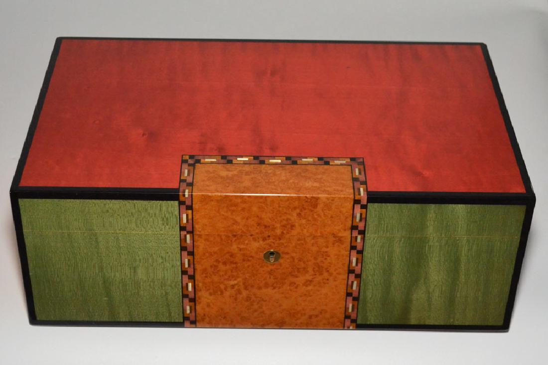 Elie Bleu Multicolor & Burl Cigar Humidor: Measures 5.75" tall x 15 7/8" long x 9 3/8" deep. Has scuffing throughout, chip to top back corner, no inner tray or key.