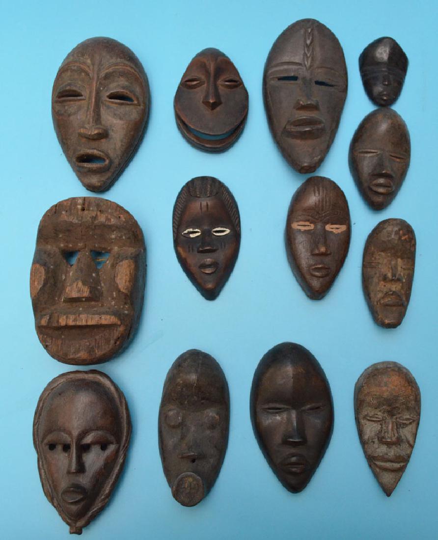 Lot of Vintage & Antique Carved African Passport Lot: Lot of various antique carved African passport mask.