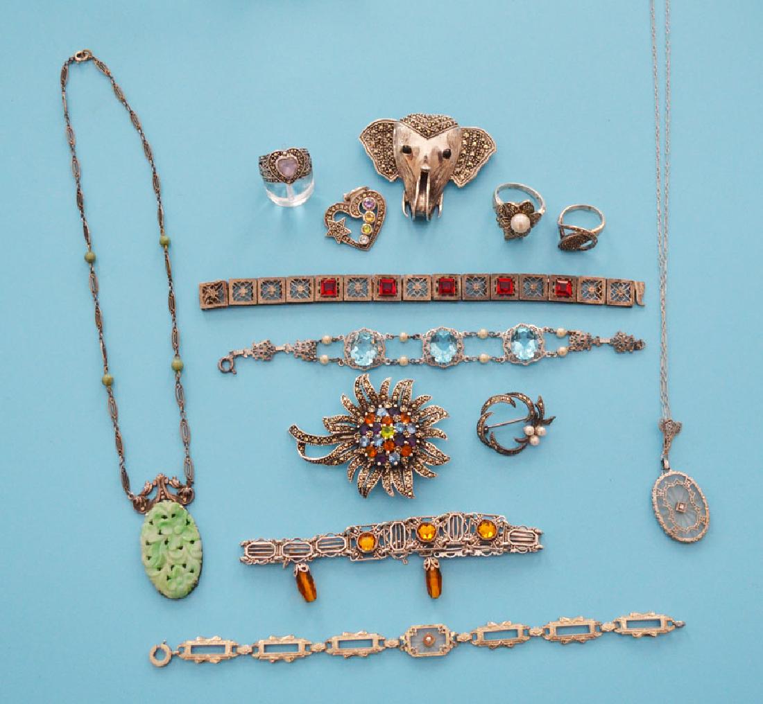 Nice Lot Of Filigree & Marcasite Jewelry: Lot includes: flower with rhinestones, elephant, 3 rings and a small pin. Elephant (1.75" x 2.25"), flower (2.25" x 1.75"), pin (1 x 1.25"). Rings are approx.. Sizes 3.5, 5 & 6. Camphor glass filigree