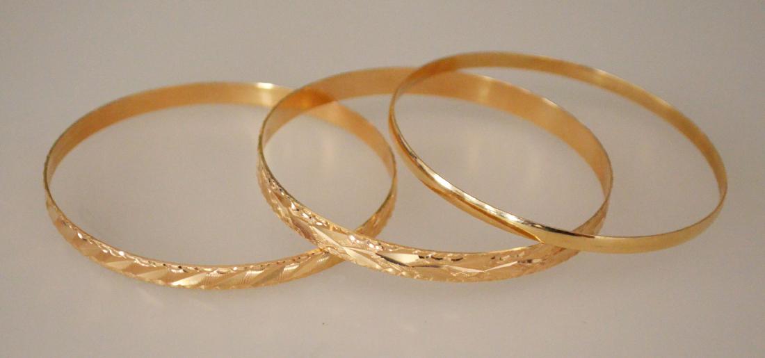 Three 18K Gold Bangle Bracelets (1 of 2)