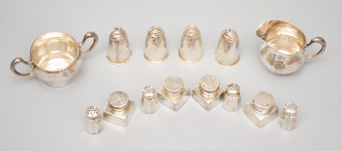 Large Grouping of Sterling Silver Table Accessories: Lot includes: 4 Gorham bee hive salt and peppers (2 5/8"t), 4 George Washington reproduction salt and peppers by B&M (1.5"), 4 salt and peppers (1 7/8"t, 2 with splits down the side), and a Mouser cre