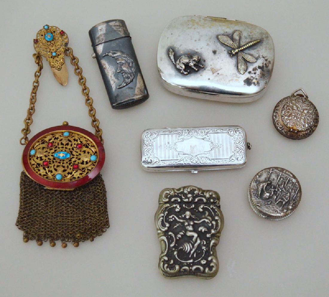 Group Of Sterling Silver And Silver Plate Smalls: Lot includes: nude woman sterling match holder, plated match holder with moon, dragonfly & cat plated box, sterling coin holder, lady's pocket watch, pill box and mesh & enamel purse. All in estate fo