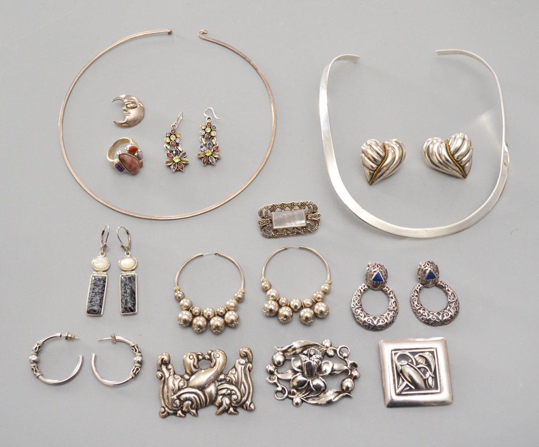 Great Lot of Sterling Silver Jewelry: Lot includes 2 necklaces, 6 pairs of earrings (mossy agate, lapis, multi stone, hoop), 4 pins (marcasite, tulip, doves, Otis), a multi stone size 7 ring and a C. Lanes? Moon pendent . Gross weight is 