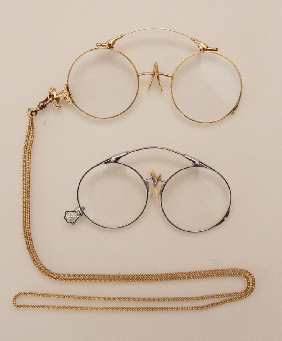 2 Antique Lorgnette Eyeglasses (One 14K Gold): Lot includes 2 pairs of lorgnettes, one pair 14k yellow gold Art Nouveau with a gold filled chain, one pair of silver tone gold filled.
