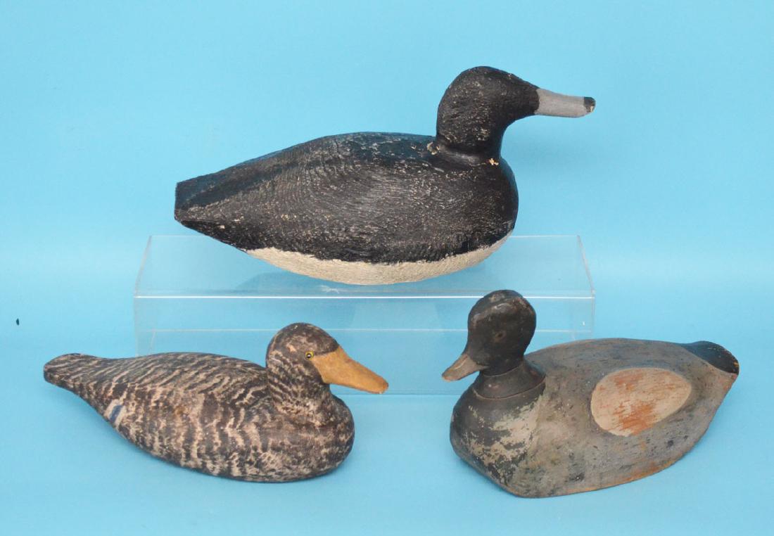 3 Vintage Wooden Duck Decoys (Richard Morgan): Black decoy measures approximately 15.25 inches long, Richard Morgan 5.5 inches tall by 13.5 inches long, black and gray that measures 6.75 inches tall by 11.25 inches long with the repair and head