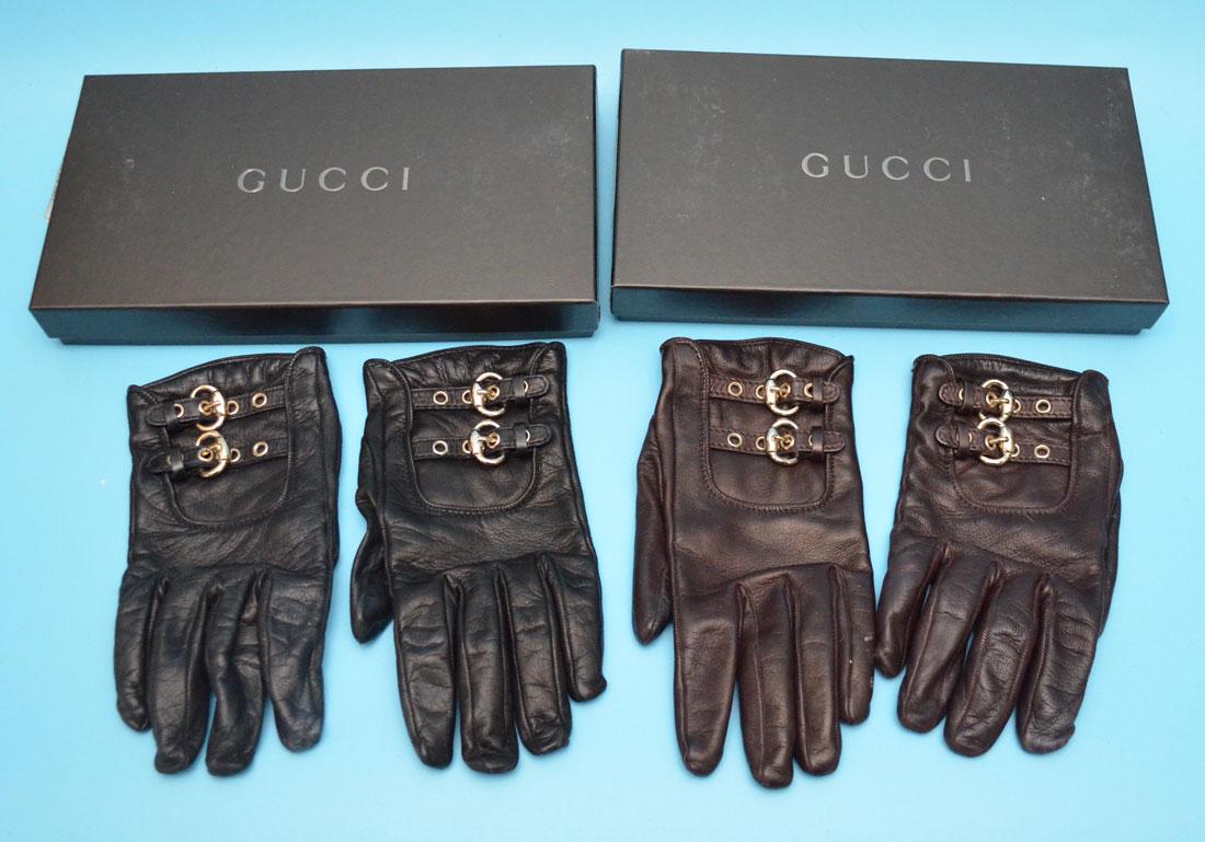 2 Pairs of Gucci Leather Gloves: 2 Pairs of Gucci Leather gloves with boxes, one brown, one black, brown have some tarnish to metal hardware