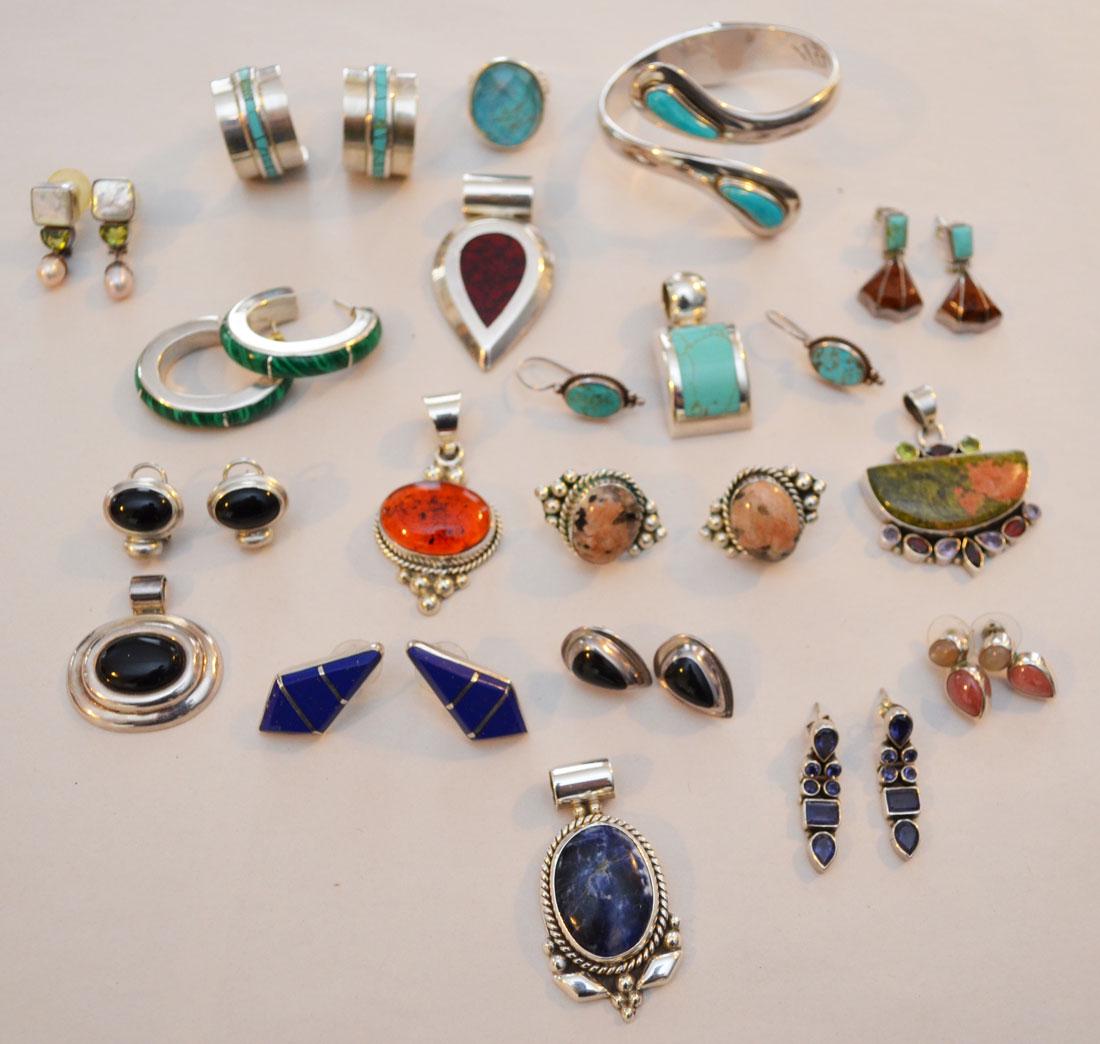 Lot of Sterling Silver & Stone Jewelry: Lot includes Onyx, Malachite, Amber, Agate, lapis, amongst others. 11 pairs of earrings, 6 pendants, a bracelet, and a ring