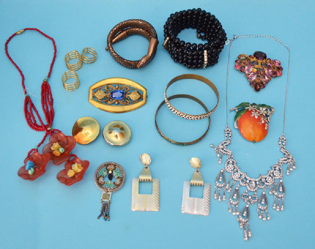 Lot of Costume Jewelry: Includes: Coraline pin, Joan Rivers necklace, snake bracelet, Robert Lee Morris clip earrings, Trifari orange clip and more.