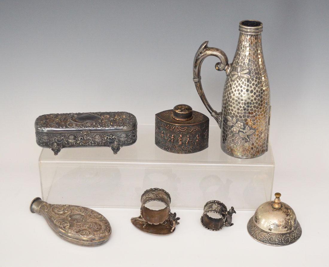 Great Lot Victorian Silver Plate ( Flasks, Napkin: Lot includes: Bottle holder (9 3/8"t), vanity box (2"t x 7" x 2.5"d), Best Wishes napkin ring with cherub wish bone and chicken foot (2.75"t), flask (6.5"t), scruffy dog napkin ring (1.5"t), Desk bell