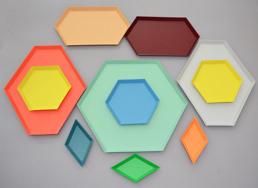 Hay Enamel Kaleido Puzzle Trays: KALEIDO, lacquered steel trays, HAY. Includes: 3 XS diamond shaped (4.25"x 7.5"), 3 Kaleido S(8.75" across), 2 Kaleido M (13.25" x 7 5/8"), 2 Kaleido L (15 3/8" x 13.25"), and a Kaleido XL (17.75" x 1