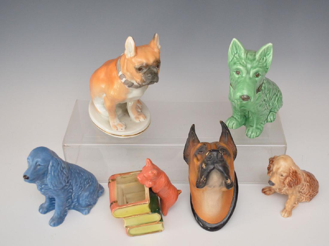 Fun Lot of Porcelain Dog Figurines: Lot includes: Lomonosov French Bulldog, 2 cocker spaniels signed England (Likely Sylvac), Sylvac Scottie or Terrier, small terrier planter with books and a papier mache great Dane bust. They range fro