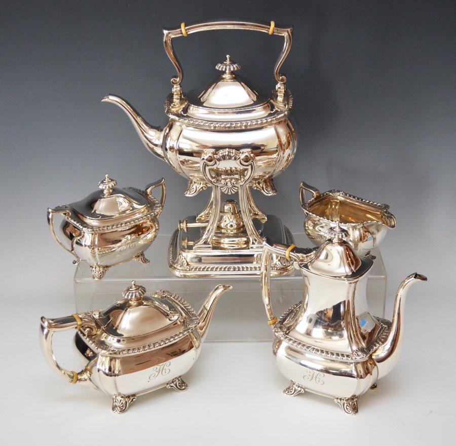 5Pc Tiffany & Co Sterling Silver Tea Service: Superb Tiffany & Co Sterling silver tea set with shell form corners and feet. Gross weight is 5462.50 gram Tallest measures 13" tall, coffee pot measures 9.25" tall. Smaller pot measures 6"tall, sugar