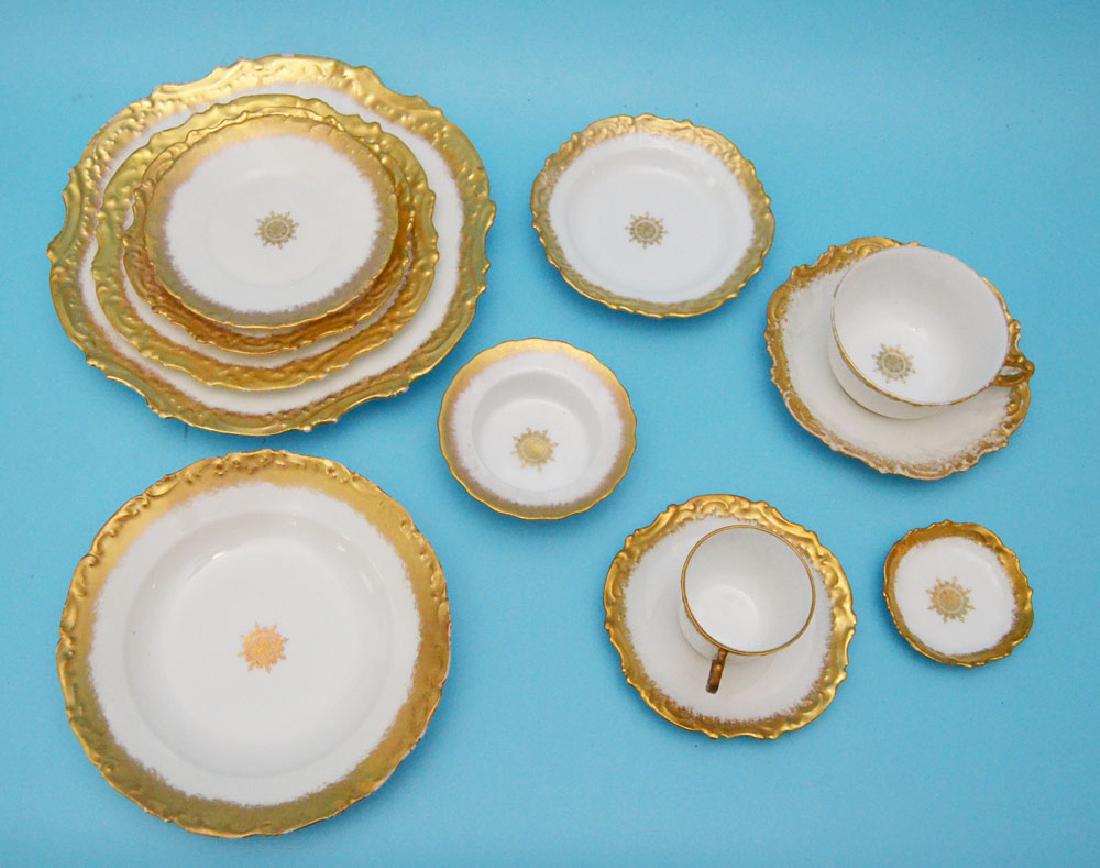 Beautiful T.V Limoges Gold Encrusted China Set: Lot includes 8 saucers 5 5/8 inches diameter, 8 small soup bowls 7.25 inches diameter, 7 small dessert plates 5 3/eights inches diameter, 8 sandwich plates 7.5 inches diameter, 8 bread plates 6.25 inc