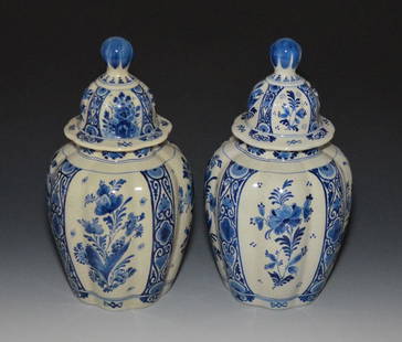 Pair of Royal Delft Covered Urns: Royal Delft (De Porceleyne Fles). They measure approx. 12.5" tall total. One has more of a yellow hue than the other.