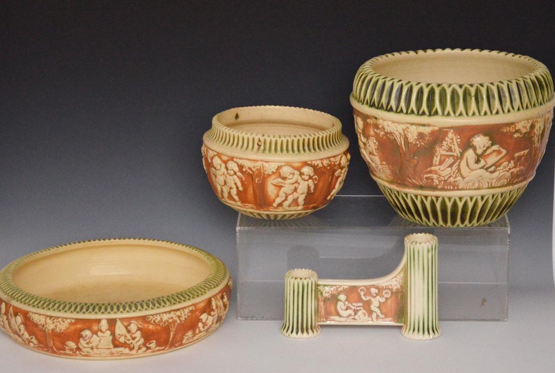 4 Pieces of Roseville Pottery Donatello: Hanging planter (5"t x 6 5/8"d at top, has dark crazing), double bud vase (5" tall, some glaze flicks to edges), low dish (3"t x 12" diameter), and jardinieres (8"t x 9 3/8" diameter at the top, inter
