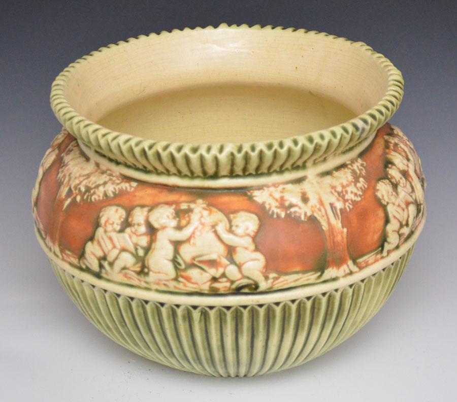 Roseville Donatello Large Jardiniere: Measures 10" tall x 11.75" diameetr at the top. Has crazing throughout, heat check in bottom of base, light interior staining.