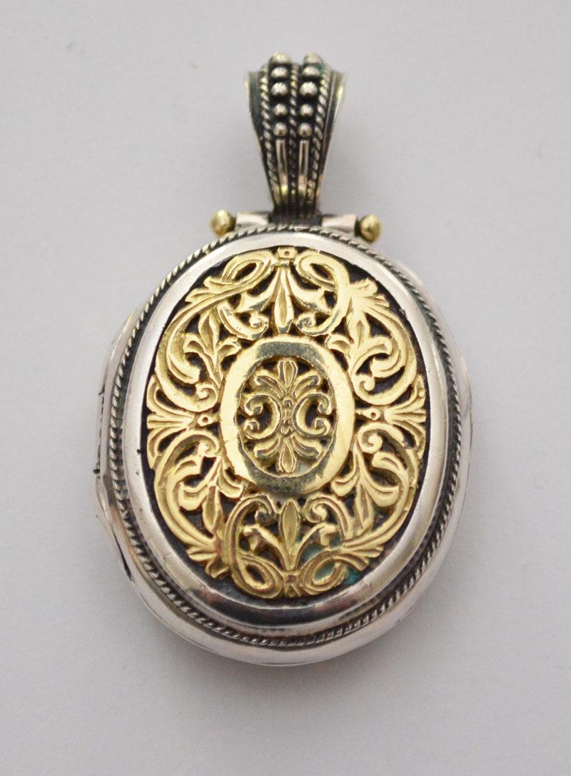 Konstantino Sterling & 18k Gold Locket: Gross weight is 17.2dwt. Locket measures 1.75" x 1". From the Estate of The Well Known Paranormal Expert And Author Rosemary Ellen Guiley