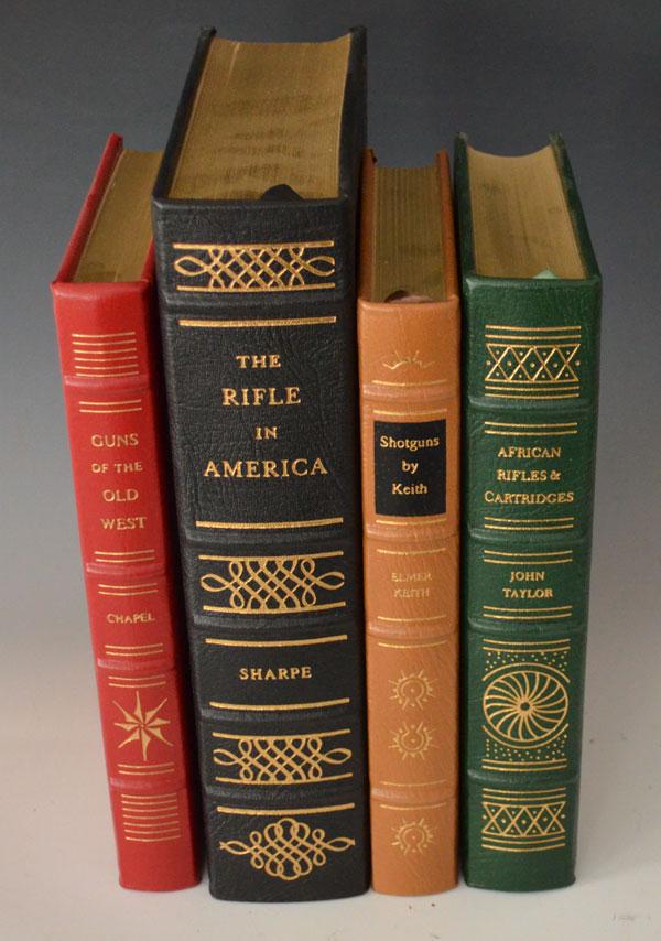 4 Firearms Classic Library Leather Bound Books: Lot includes The Rifle in America by Philip B. Sharpe, African Rifles and Cartridges by John Taylor, Shotguns by Keith by Elmer Keith, Guns of the Old West by Charles Edward Chapel