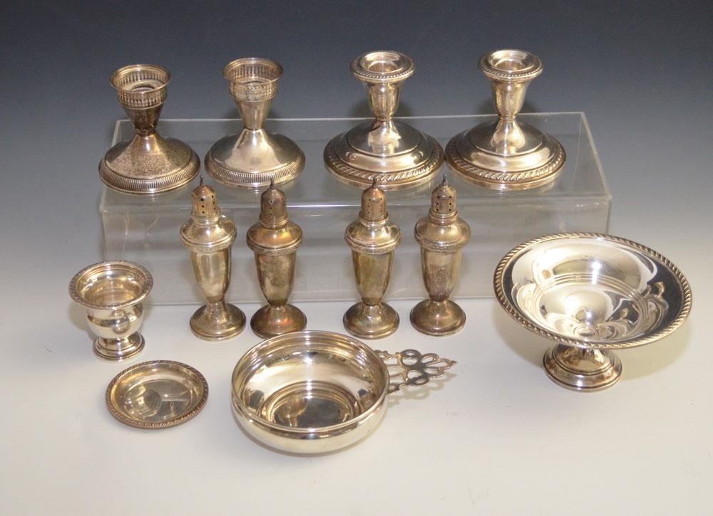 Large Lot Of Vintage Sterling Table Accessories: Lot includes: Pair of Duchin weighted candlesticks, unbranded weighted candlesticks, 4 weighted salt & peppers, weighted toothpick holder, sm reed & Barton dish, Gorham Porringer. Gross weight of dish