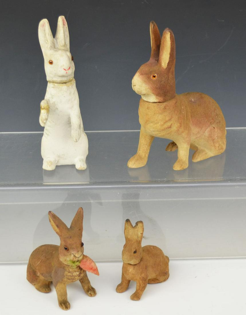 4 Antique Rabbit Candy Containers: Sizes range from 3 1/4" to 6 1/2" tall. In estate found condition with wear due to age and use.