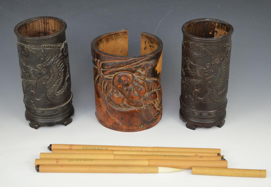 3 Antique Bamboo Chinese Brush Pots & Brushes: 3 brush pots. The 2 dragon ones are 7 1/2" tall and the top rim measures 3 1/2" The other one is 6 1/4" tall and 4 3/4"wide . It has a big split . In estate found condition with wear due to age.