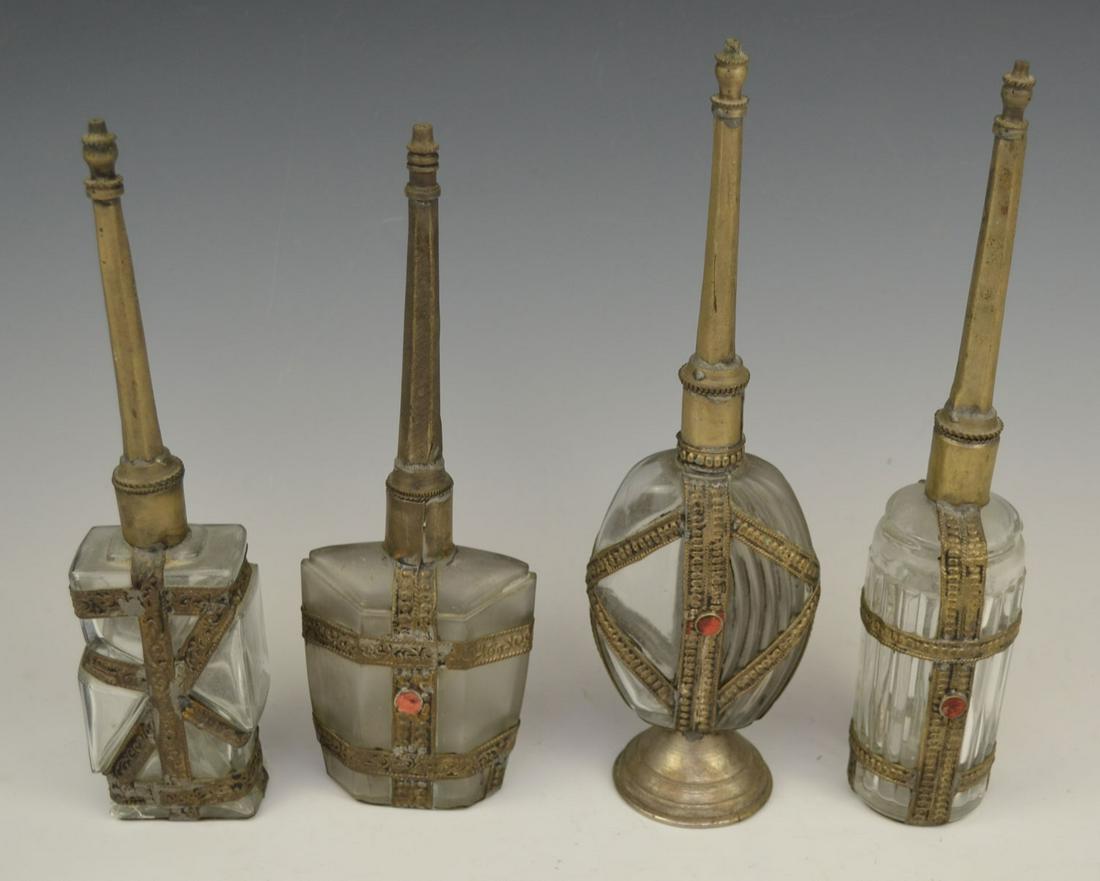 Lot Of 4 Middle Eastern Rose Water Bottles: Range in height from 9 1/2" to 10 1/2". In estate found condition with wear due to age.