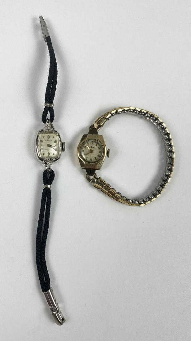 2 14k Gold Vintage Lady's Watches Lyceum, Gruen: Jewelry lots must be paid for by check or wire transfer unless you are known to us. The lyceum bezel is 5/16" x 1" and is not working. The Gruen precision bezel is 1/2" x1" and is notworking.( It is a