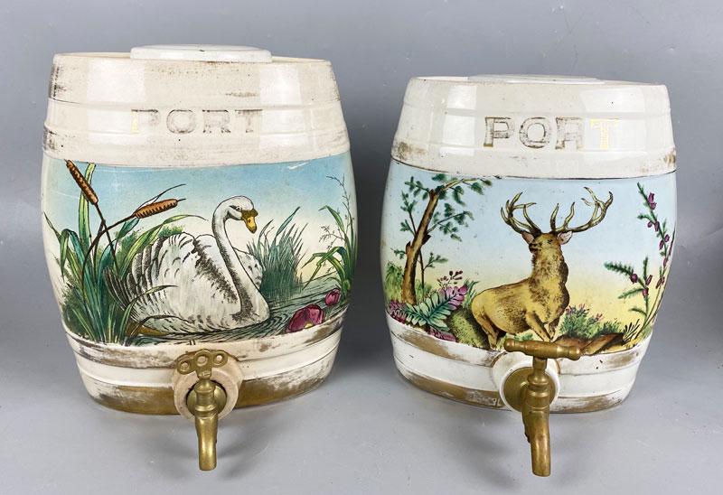 2 Scenic Porcelain Port Wine Dispensers: These measure approximately 11 1/4" tall. They are approximately 9 1/2" wide. The one with the buck ( deer ) has a chip on the rim. In estate found condition with wear due to age and use. Some stains 