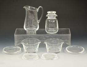 Lot of Steuben Glass: Monogrammed WTC of A. Lot includes 2 thick plates (5" diameter) 2 thick plates ( 4" diameter), Pitcher ( 7 1/2" tall and 5 7/8" from spout to handle. 2 bowls ( 2 7/8" tall x 5 1/2" x 4 3/4") and 1 lid