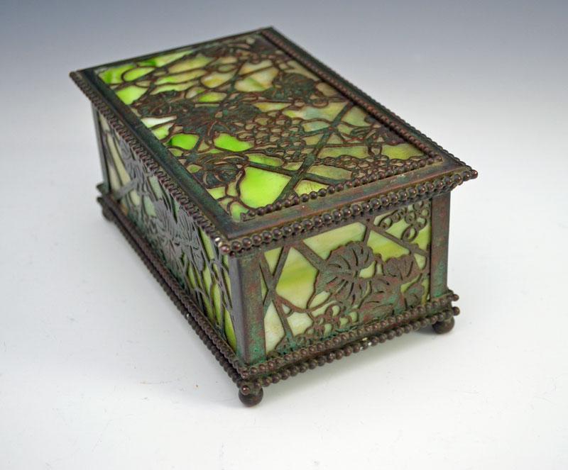 Great Tiffany Studios Bronze & Stained Glass Grapevine: Box measures 6 3/4" wide x 4 1/16" deep by 3" tall. No cracks in glass. Missing some beading on top.