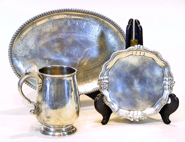 London & Irish 3 Piece Sterling Silver Lot: Sterling oval tray with hallmarks (London 1854) Measuring 9" x 6 1/4 " Approx 7 troy oz.with some scratches and knife marks. Sterling Irish footed card tray with hallmarks (1730 - 1820) 5 1/2" x 5 1/2