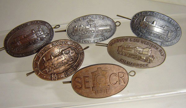 Lot 6 Antique Railroad Cap Badges: lot 6 Antique Railroad Cap Badges 1: SECR 2: L & N.W.R. Co. Crewe Works 3: Great Western Railway Co. 4: North Eastern Railway Gateshead Loco Dept. Darlington 5: Glasgow & South Western railway Kilmarn