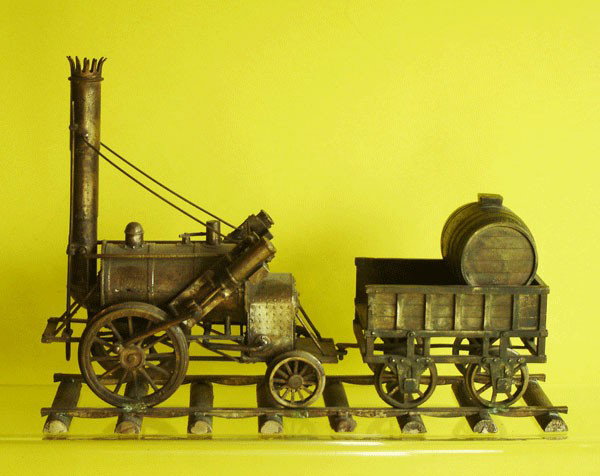 Antique Brass Model of " The rocket ": Antique Brass Model of " The rocket " Has a 1 7/8" gauge and the track measures 10" Long