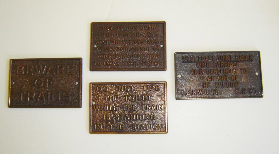 4 Miniature Bronze Plaques: Beware of trains, do not use the toilet while the train is standing in the station, west coast joint stock wide carriage it is dangerous to lean out of the window L.&N.W.R. Co. C.R. Co., not to run ov