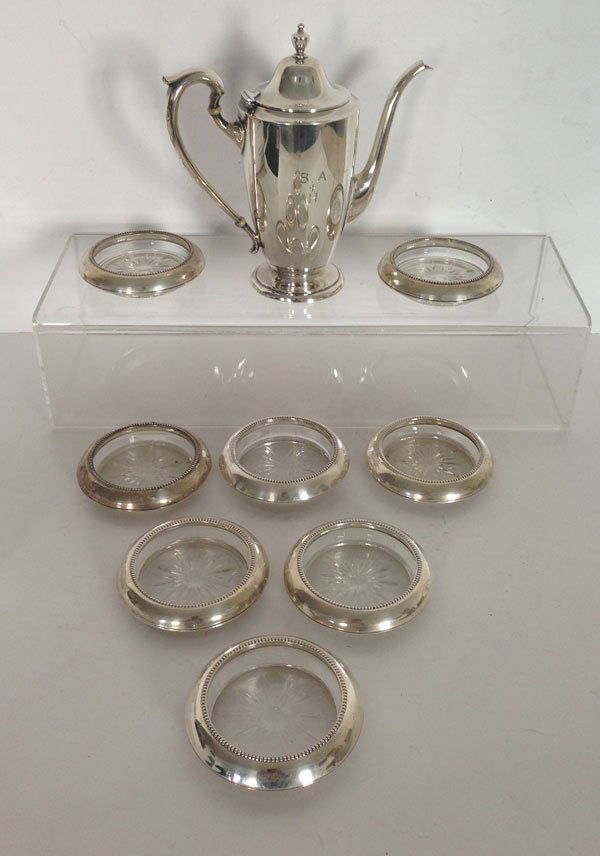Vintage Sterling Teapot And Sterling Coasters: teapot grosses 11.59 ozt. and measures 7 1/2 (H) 3 (W) X 3 1/2 (D)inches. 6 sterling and glass coasters.