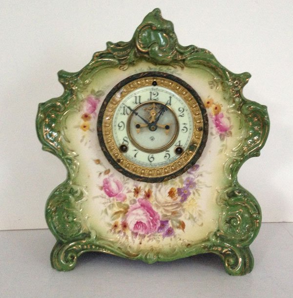 Ansonia Royal Bonn La Voque Porcelain Clock: Royal Bonn Germany 1755. Ansonia Clock Co. patented June 14, 81 New York. The clock measures 11 x 13 x 5 inches.