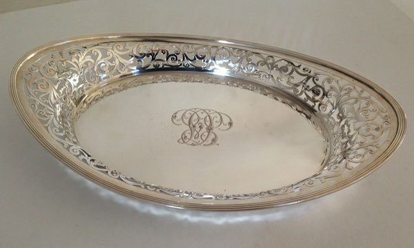 A Fantastic Heavy Sterling Silver Filigree Serving Bowl: It measures 1 1/2(H) x 14 (L) x 9(W)inches. It is hallmarked Sterling Theodore B. Starr 555. The gross weight is approx. 24.55 OZT.