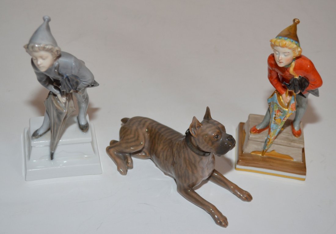 3 Royal Copenhagen Figurines: Boxer dog measures 6.25" long x 3.75" tall. The boys with umbrellas are 7" tall x 3" long at base.