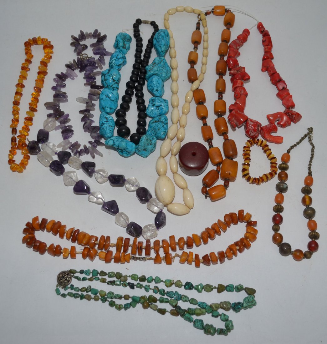 Great Lot Of Vintage Coral, Amber, And Ivory Jewelry: Ebony is 18" long, ivory 29.25" long, Amber 25" long, barrel shaped amber necklace 26.74" long, amethyst & quartz 19.5" long, amethyst necklace 19" long, amber and metal neclace 17.5" long, last amber