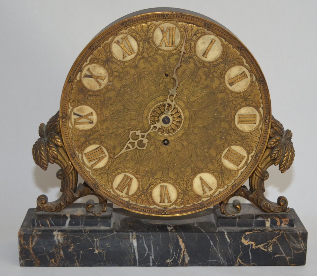 EF Caldwell Gilt Bronze Ormolu Clock on Marble Base: Stunning clock, signed on reverse E.F. Caldwell. Measures 11.25" tall on 12.75" x 3" base. Dial is 9 1/8" diameter.