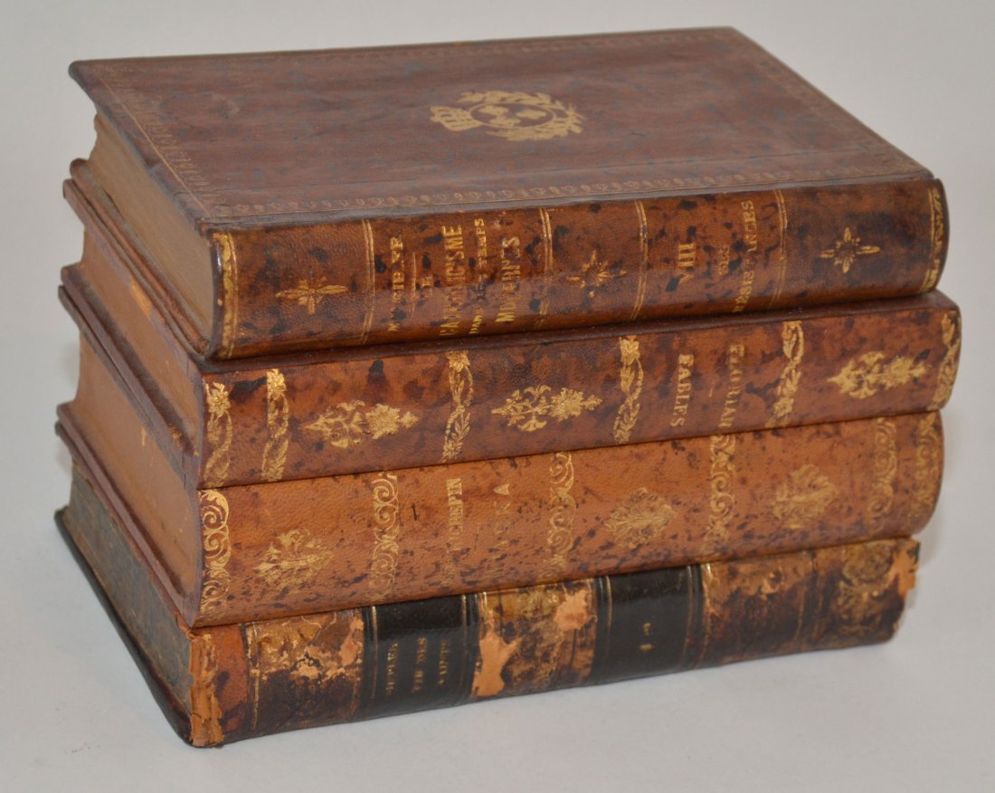 Stacked Leather Book Secret Liquor Tantalus: Great leather bound book "stash box" with 2 decanters and 5 glasses. Glasses measure 2" tall x 1.25" diameter at top. Decanters measure 4.75" tall x 1.75" square. Box itself measures 5.5" tall x 8" lo